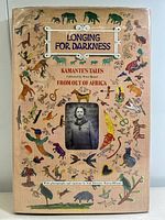 Front cover dust jacket showing title, author credit and animal motif illustrations.