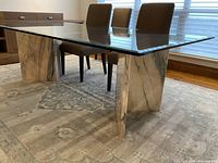 Full side view showing glass top and marble base