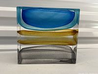 Front view showing three distinct colored layers in clear rectangular block