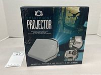 Front view of box showing device image and capability to project up to 40-inch screen