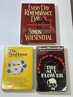 Three hardcover books: Every Day Remembrance Day top, two copies of The Sunflower at bottom