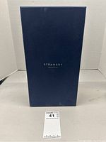 Navy blue closed box with 'STEAMERY Stockholm' text on top front face.