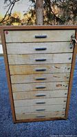 Front view of vintage STACOR steel 10-drawer cabinet showing all drawers, handles, and locks.