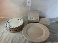 Full set of Kate Spade Lenox plates: stacks of party plates, dinner plates with textured rim, and Sandpiper plates with bird motifs.