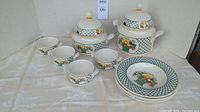 Full set of Villeroy & Boch Basket pattern soup service including tureens, bowls, and plates on display.