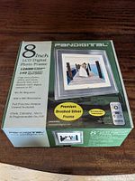 Box of the Pandigital 8-inch LCD digital photo frame showing features such as 1280x800 resolution, brushed silver frame, and inclusion of remote control.