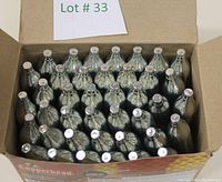 Open box containing 40 silver CO2 cartridges arranged upright in a grid