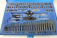 Open view of the 60-piece tap and die set showing taps, dies, wrenches, and handles organized in the blue metal case.