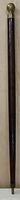 Full length view of the wooden cane with brass handle