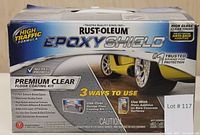 Closed box of Rustoleum Epoxy Shield Premium Clear Floor Coating Kit showing brand, product details, and features.
