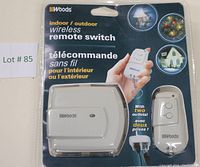 Front packaging of Woods Indoor/Outdoor wireless remote switch showing product and remote control in blister pack.