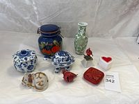 Full view of all 8 items in the home decor bundle assembled on white fabric background