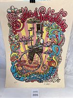 Full front view of poster hanging against white background showing Belle & Sebastian design and color