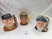 Front view of the set of three Royal Doulton character mugs showing the golfer, man with fur hat, and bearded man.