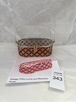 Full view photo of vintage 1950s Lucite and metal box purse showing overall design and clear Lucite handle.