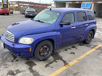 Front-left three-quarter view showing exterior condition, paint discoloration and front steel wheel.