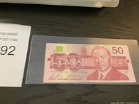 Front view of Canadian $50 bank note, showing portrait of William Lyon Mackenzie King and series details.