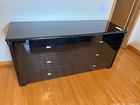 Front view showing six drawers and high-gloss lacquer finish