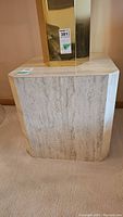 Front view of travertine marble cube side table with lamp not included