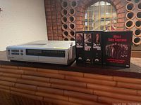 Full view of Panasonic Omnivision VHS player with The Godfather and The Sopranos box sets on display.