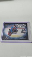 Clear image of Cale Makar rookie card with 'Thrilling Finishes' and e-Sports branding, showing him in Avalanche jersey skating.
