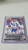 Front of Connor McDavid rookie hockey card that shows him in Edmonton Oilers jersey with stats and Biography of a Season text.