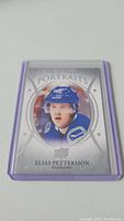 Close-up image of the Elias Pettersson rookie hockey card in a protective sleeve.