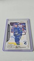 Photo of Elias Pettersson O-Pee-Chee Marquee Rookie hockey card 2/10 in protective sleeve