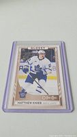 Glossy rookie hockey card featuring Matthew Knies in Toronto Maple Leafs uniform, card number 369 in O-Pee-Chee series.