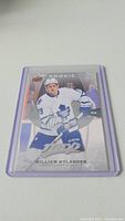 Clear photo of William Nylander rookie hockey card encased in a protective sleeve showing player's image, details, and signature