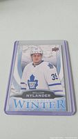 Close-up photo of William Nylander rookie card showing him in white Toronto Maple Leafs jersey with blue maple leaf and number 29.