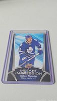 Clear image of William Nylander hockey card in blue Toronto Maple Leafs uniform, part of the Upper Deck Instant Impression series.