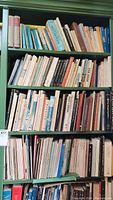 Four shelves of books spanning topics in music and art, showing various titles with visible spines.