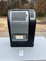 Front view of large Lasko space heater showing the metallic mesh heating panel and digital controls