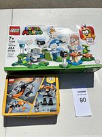 Photo showing unopened LEGO Super Mario Lakitu Sky World set and LEGO Star Wars set 31111 with piece counts and boxes visible.