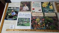 Overview of 8 gardening books laid flat showing covers with garden and plant images.