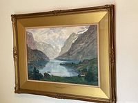 Full view of framed watercolor showing lake, mountains and gilt wood frame