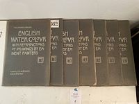 Set of eight softcover volumes titled 'The Studio Library English Water-Colour' Parts 1 through 8, arranged side by side showing covers with white lettering on gray paper covers.