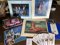 Overview shot of all items: three lithographs, die-cast car, postcards, Disney Dollars, pin set, brochure