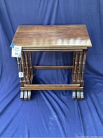 Front view of all three tables nested together