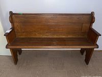 Front view of full bench showing seat, back and both end panels