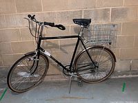Full side profile of Norco Tourister bicycle showing frame, handlebars, wheels and fenders