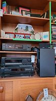 Front shelf showing Sony cassette deck and a Bose speaker to the right, part of stereo system setup.