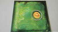 Green snake-skin style album cover with gold medallion and K Tel logo