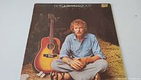 Front album cover featuring Gordon Lightfoot sitting cross-legged with acoustic guitar.