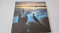 Front cover of the Roxy Music Avalon vinyl album showing atmospheric design with sculptures and title.