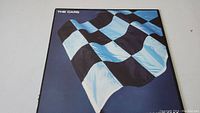Front cover of The Cars Panorama vinyl album showing a blue and black checkered flag.