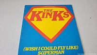 Front of the vinyl single sleeve showing The Kinks logo inside a Superman emblem and the song title.