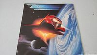 Front cover of ZZ Top Afterburner vinyl LP showing spaceship artwork and album title in shiny blue font.
