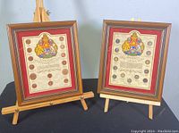 Two framed Canadian coin collections (pennies and dimes) side-by-side displayed on wooden easels showing full view of each frame and coin arrangement.